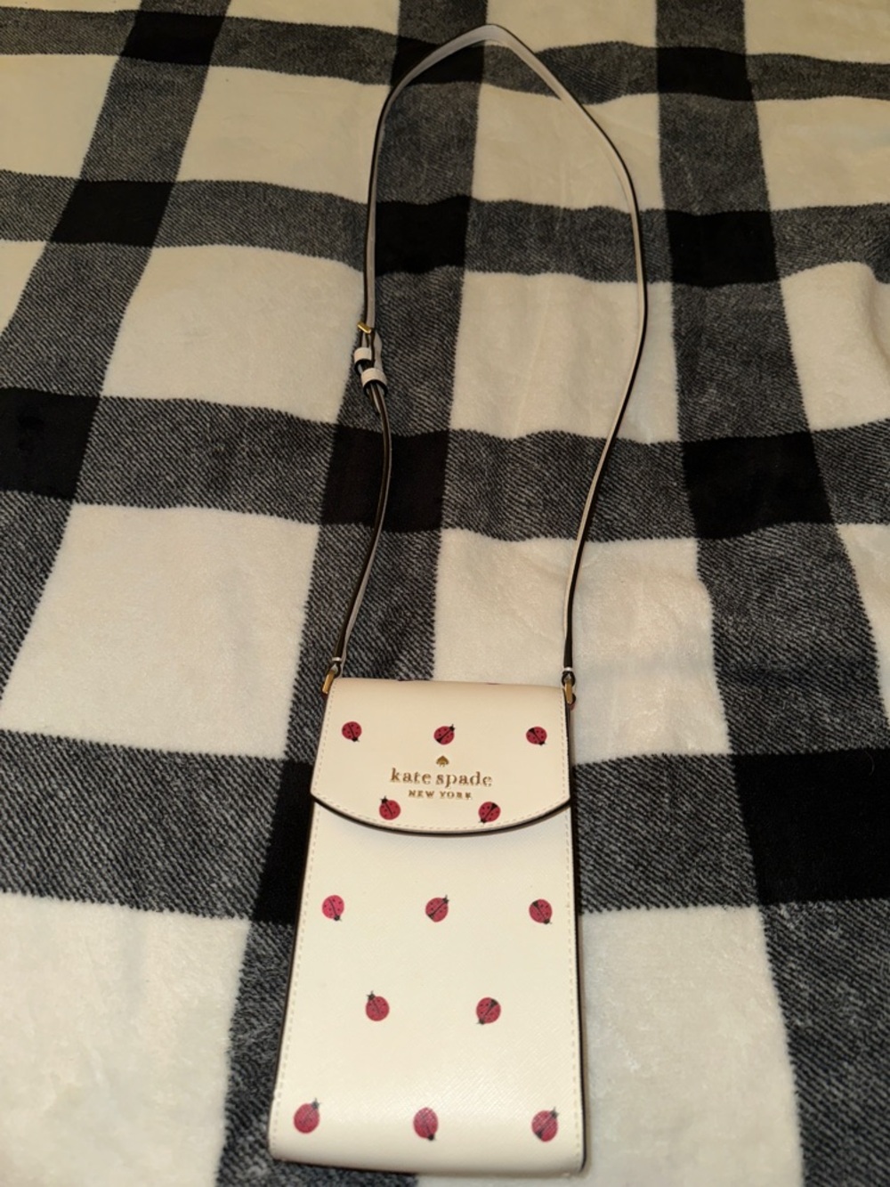 kate spade white crossbody phone bag with ladybug print